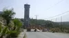 A closed Israeli gate and watchtower on the road into Beit Ommar