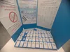 Ballot slips for each party list laid out in a voting booth at an Israeli polling station