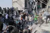 Rescuers and residents dig through the rubble of the Shajareh Tayyebeh elementary school in Minab, Iran, after the U.S. strike on 28 February 2026