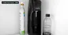 A SodaStream machine with a gas canister and a bottle