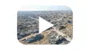 The YouTube play button over the rubble of Rafah