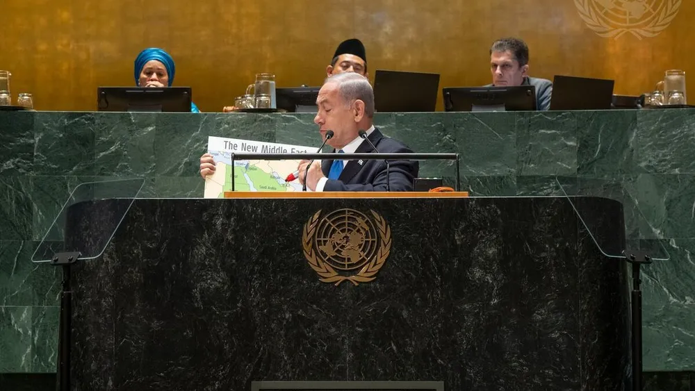 Netanyahu at the UN General Assembly podium holding up a map titled The New Middle East