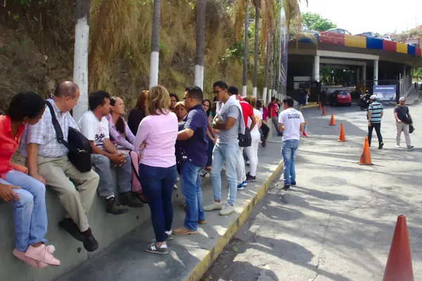 Relatives of prisoners wait outside El Helicoide in Caracas