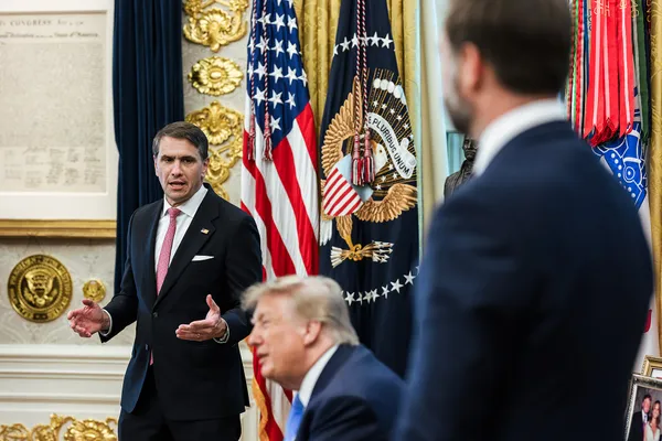 Todd Blanche speaks in the Oval Office as Donald Trump sits in front of him